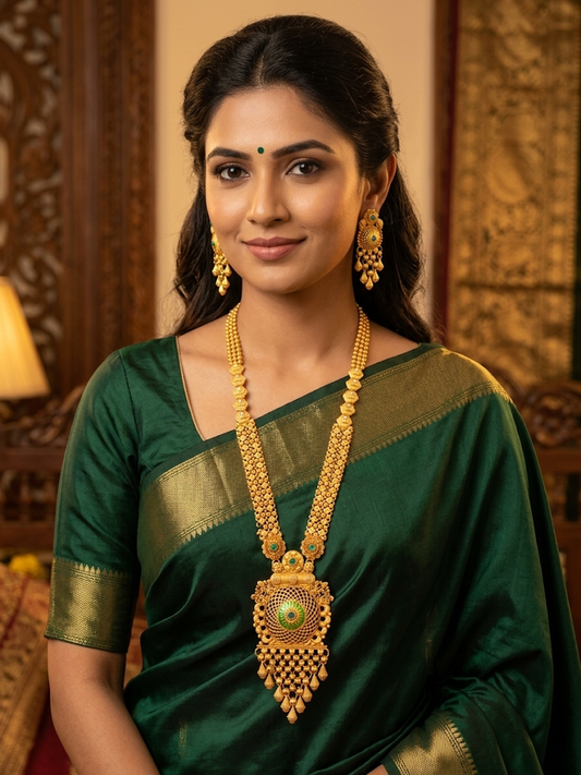 Traditional Gold Temple Jewelry Set: Long Haram Necklace and Matching Jhumka Earrings with Red Stone Accents and Pearl Drops
