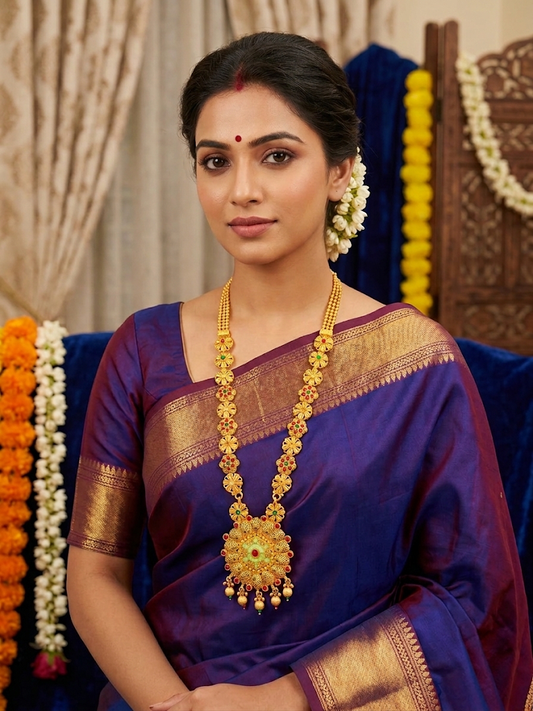 Traditional Gold Temple Jewelry Set: Long Haram Necklace and Matching Jhumka Earrings with Red Stone Accents and Pearl Drops